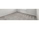Corner view of carpeted bedroom with window and baseboard trim at 7509 Oak Spring Ln, Davenport, FL 33837