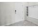 Foyer entrance view featuring a white front door with sidelight and a built-in storage bench at 7509 Oak Spring Ln, Davenport, FL 33837