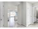 Hallway view showcasing tile floors leading to the kitchen, living area and access to the screened pool at 7509 Oak Spring Ln, Davenport, FL 33837