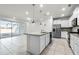 Open-concept kitchen with granite countertops, stainless steel appliances, and sliding doors leading to a pool at 7509 Oak Spring Ln, Davenport, FL 33837