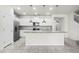 Bright kitchen featuring stainless steel appliances, granite countertops, and a large island with pendant lighting at 7509 Oak Spring Ln, Davenport, FL 33837