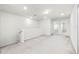 Open loft area with neutral carpeting, abundant natural light, and a versatile space for various activities at 7509 Oak Spring Ln, Davenport, FL 33837