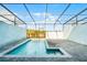Inviting in-ground pool with covered patio and brick pavers at 7509 Oak Spring Ln, Davenport, FL 33837