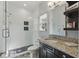 This remodeled bathroom features a glass shower, updated vanity, and modern finishes at 8424 Lake Burden Cir, Windermere, FL 34786