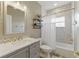 Bathroom featuring a tiled shower, neutral color scheme, and modern vanity at 8424 Lake Burden Cir, Windermere, FL 34786