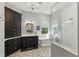 Relaxing bathroom offers a soaking tub, a walk-in shower, and storage cabinets at 8424 Lake Burden Cir, Windermere, FL 34786