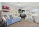 Bedroom with a ceiling fan, a bed with a blue quilt, and storage for footwear and accessories at 8424 Lake Burden Cir, Windermere, FL 34786