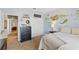 Cozy bedroom features lake-themed decor and a mural, closet, and neutral carpet at 8424 Lake Burden Cir, Windermere, FL 34786