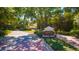 Keene's Pointe community entrance with brick signage, mature trees, and manicured landscaping at 8424 Lake Burden Cir, Windermere, FL 34786