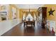 Inviting dining room with tile floors, a chandelier, and an antique cabinet against yellow walls at 8424 Lake Burden Cir, Windermere, FL 34786