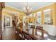 Spacious dining room showcasing tiled floors, chandelier lighting, and an open layout at 8424 Lake Burden Cir, Windermere, FL 34786