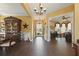 Charming foyer featuring tile floors, stylish decor, and ample natural light at 8424 Lake Burden Cir, Windermere, FL 34786