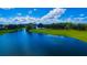 Scenic aerial view of the golf course and beautiful lake at 8424 Lake Burden Cir, Windermere, FL 34786