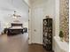 Hallway view of bedroom with tiled floors, ceiling fan, and decorative wall accents at 8424 Lake Burden Cir, Windermere, FL 34786