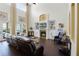 Bright living room with fireplace, soaring ceilings, and access to the outdoor area at 8424 Lake Burden Cir, Windermere, FL 34786