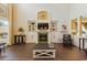 Cozy living room featuring built-in shelves, a fireplace, and tile flooring at 8424 Lake Burden Cir, Windermere, FL 34786