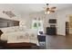 Inviting bedroom features natural light, ceiling fan, tile flooring, and neutral color palette at 8424 Lake Burden Cir, Windermere, FL 34786
