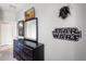Nicely decorated bedroom with Star Wars theme and a large dresser for ample storage at 8961 Cuban Palm Rd, Kissimmee, FL 34747