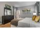 Serene bedroom with soft lighting, tasteful decor, and a relaxing atmosphere for a comfortable night's sleep at 8961 Cuban Palm Rd, Kissimmee, FL 34747