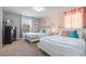 The lovely bedroom has two twin beds, soft pastel colors, and pretty fairy decorations at 8961 Cuban Palm Rd, Kissimmee, FL 34747