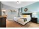 Cozy bedroom featuring soothing wall colors, comfortable bedding, and natural light for a restful retreat at 8961 Cuban Palm Rd, Kissimmee, FL 34747