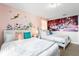 Delightful bedroom with two twin beds, soft pastel colors, fairy decorations, and entertainment themes at 8961 Cuban Palm Rd, Kissimmee, FL 34747