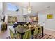 Open floor plan showcases a modern dining area seamlessly connected to the living room and kitchen at 8961 Cuban Palm Rd, Kissimmee, FL 34747