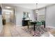 Bright dining room featuring modern furnishings, a colorful rug, and decorative lighting fixture at 8961 Cuban Palm Rd, Kissimmee, FL 34747