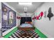 Fun game room with a pool table and Wonderland mural, perfect for entertainment at 8961 Cuban Palm Rd, Kissimmee, FL 34747