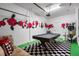 Eclectic game room featuring a pool table, graffiti-style art, and unique decor at 8961 Cuban Palm Rd, Kissimmee, FL 34747