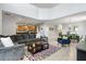Open-concept living area seamlessly connects the living room, kitchen, and dining areas, creating an ideal space for gatherings at 8961 Cuban Palm Rd, Kissimmee, FL 34747
