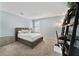 Bedroom featuring neutral colors, a full size bed, desk, dresser and black bookcase at 9192 Bradleigh Dr, Winter Garden, FL 34787