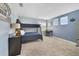 A blue painted room with a bunk bed, desk, and metal locker at 9192 Bradleigh Dr, Winter Garden, FL 34787