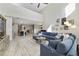 Open-concept living room flows into the kitchen, featuring lots of natural light and comfortable seating at 9192 Bradleigh Dr, Winter Garden, FL 34787