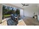 Screened patio featuring comfortable seating, a ceiling fan, and a view of the lush backyard at 9192 Bradleigh Dr, Winter Garden, FL 34787