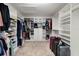 Spacious walk-in closet with built-in shelving and ample storage space for clothes and accessories at 9192 Bradleigh Dr, Winter Garden, FL 34787