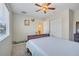 Bedroom featuring a ceiling fan, closet, and charming decor at 9227 Pecky Cypress Way, Orlando, FL 32836