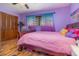 Charming bedroom featuring wood-look flooring, a ceiling fan and a spacious wooden closet at 122 Spring Chase Cir, Altamonte Springs, FL 32714