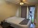 Cozy bedroom with neutral walls and a sliding glass door to a balcony at 125 Water Front Way # 200, Altamonte Springs, FL 32701