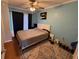 Cozy bedroom featuring a ceiling fan, area rug, and light blue walls at 125 Water Front Way # 200, Altamonte Springs, FL 32701