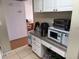 Kitchen counter top with microwave oven, coffee maker, and various kitchen appliances at 125 Water Front Way # 200, Altamonte Springs, FL 32701