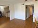Living room and entryway with wood floors and access to other rooms at 125 Water Front Way # 200, Altamonte Springs, FL 32701