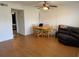 Open-concept living room with hardwood floors, a ceiling fan, and natural light at 125 Water Front Way # 200, Altamonte Springs, FL 32701
