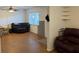 Living room with a ceiling fan, wood floors, couch and a window at 125 Water Front Way # 200, Altamonte Springs, FL 32701