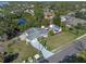 Aerial view of a house with a large backyard and mature landscaping near a wooded area at 1300 Conrad Dr, New Smyrna Beach, FL 32168
