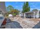 Backyard featuring a gravel area with a patio, shed, pergola, and a partially fenced yard at 1300 Conrad Dr, New Smyrna Beach, FL 32168