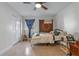 Bedroom featuring a ceiling fan, eclectic decor, and built in closet at 1300 Conrad Dr, New Smyrna Beach, FL 32168