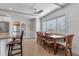 Bright dining room with large window providing natural light and nice furnishings at 1300 Conrad Dr, New Smyrna Beach, FL 32168