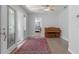 Inviting entryway with beautiful rug leading to a view of the bedroom and piano at 1300 Conrad Dr, New Smyrna Beach, FL 32168