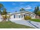 Beautiful home with a well-manicured lawn and a spacious driveway at 1300 Conrad Dr, New Smyrna Beach, FL 32168